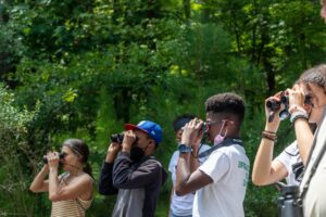 Students learn to use binoculars at Chapel Hill library